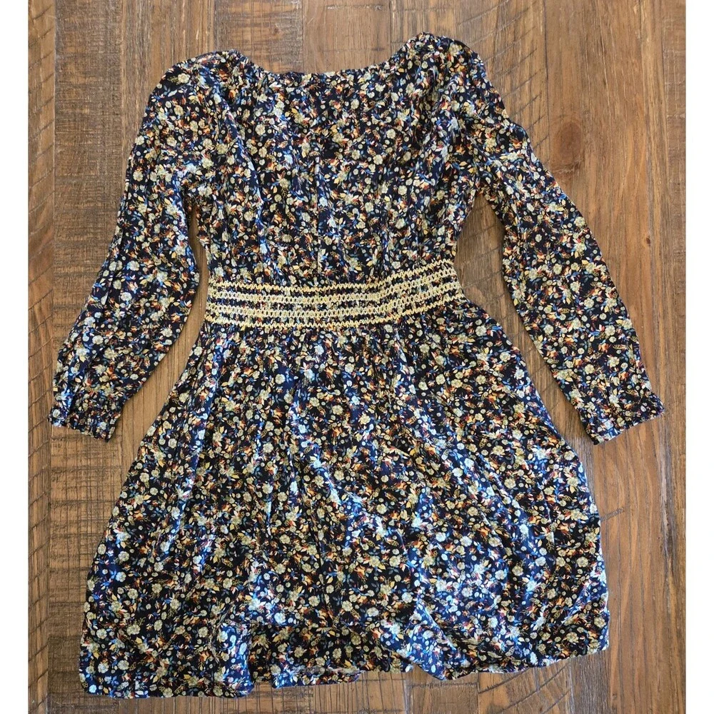 Tiny Sugar Dress Kids size 7 label and a colorful floral pattern on a black...